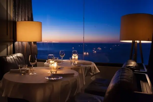 Candlelit dinner facing the ocean at sunset, Casablanca