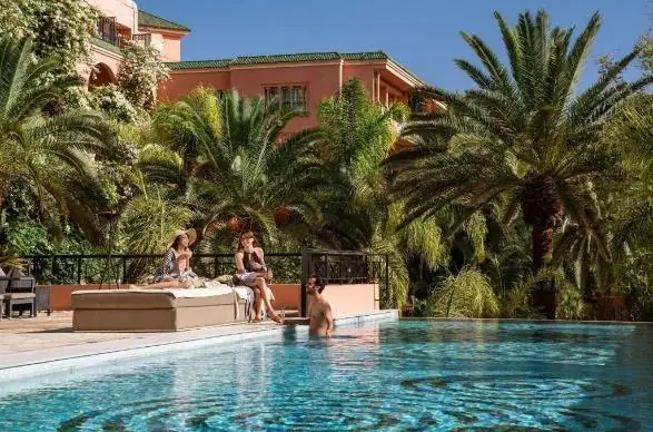 Pool surrounded by palm trees, Sofitel Marrakech