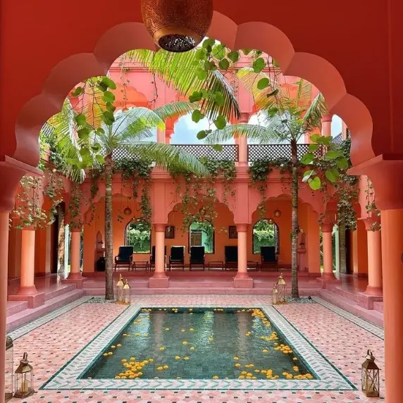 Riad patio with red walls, pool and arcades, Marrakech