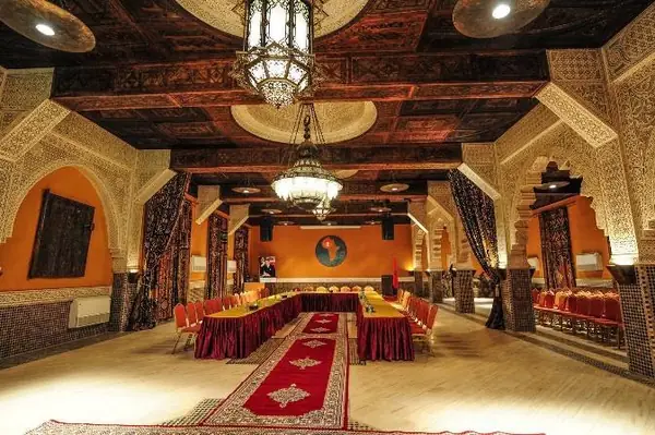Dining room of a kasbah hotel with chiselled lanterns, Merzouga