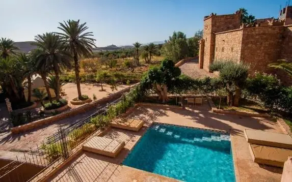 Kasbah, pool and palm grove seen from above, Ouarzazate