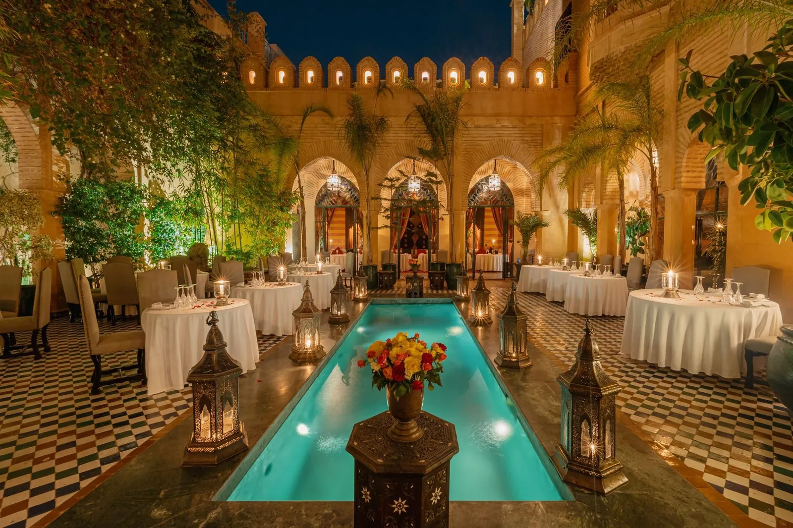 Illuminated riad patio with pool, Dar Yacout in Marrakech