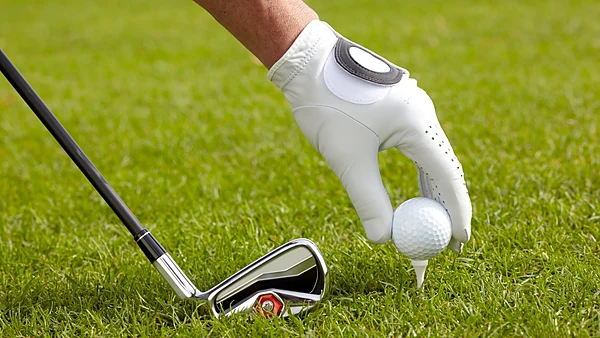 Golf ball set on the tee, ready to drive