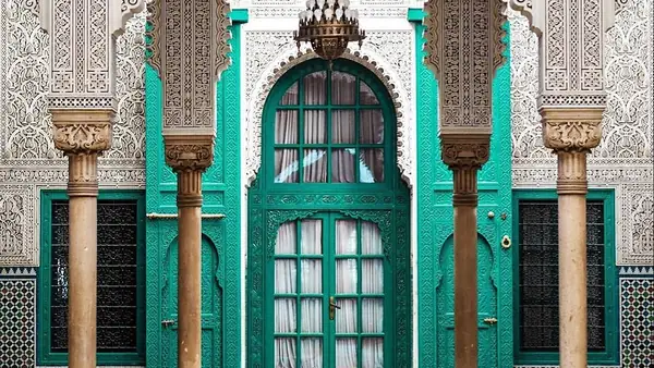 Green wooden door and carved zellige, Fez