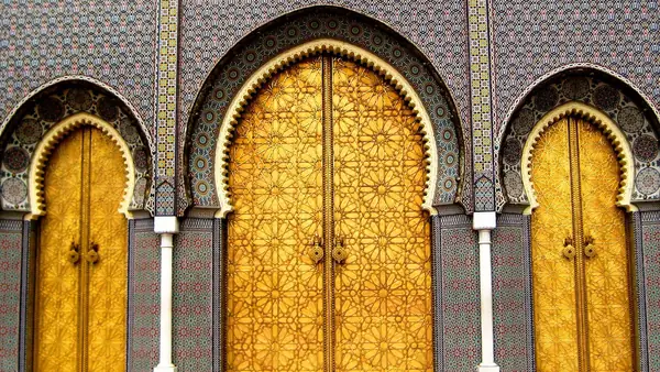 Golden doors and zellige of the royal palace in Fez