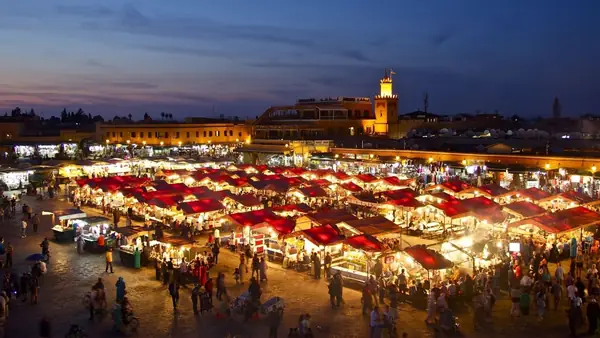Jemaa el-Fna square lit up at nightfall, Marrakech