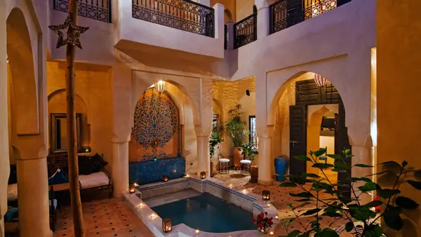 Riad patio with pool, arcades and zellige