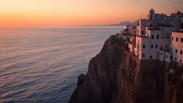 Tangier's white medina on the cliff, facing the strait at sunset